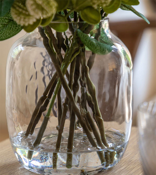 Artificial flower arrangement in vase